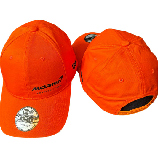 Official McLaren Formula 1 Team cap featuring papaya orange color, embroidered team logo, curved brim, and adjustable strap – ideal F1 merchandise for McLaren fans and motorsport collectors.