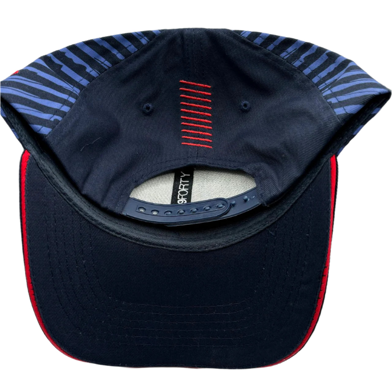 Official Oracle Red Bull Racing Formula 1 Team hat with navy blue design, bold team logo, curved brim, and adjustable fit – premium F1 cap for Max Verstappen fans and racing enthusiasts.